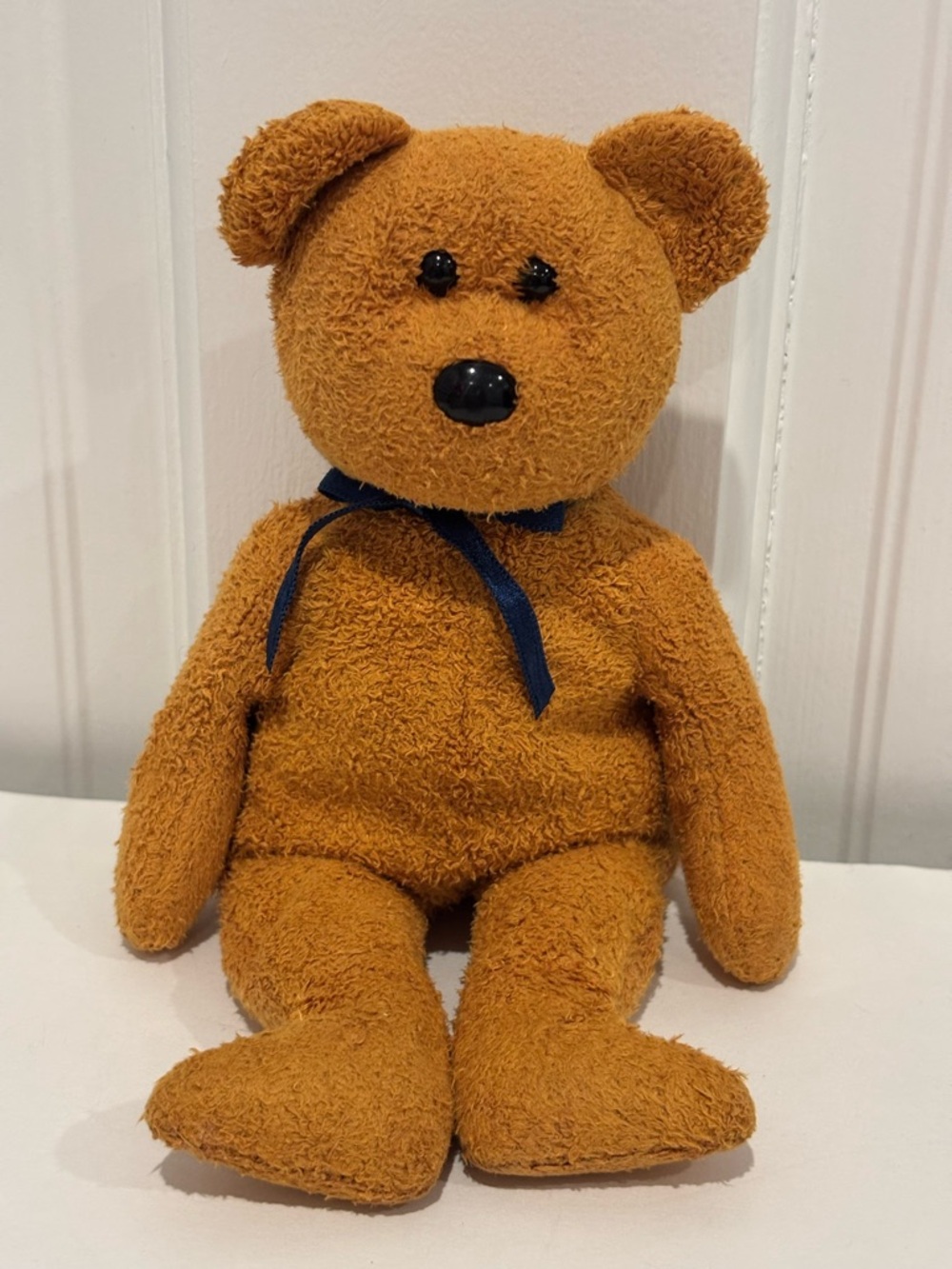 Ty Beanie Baby Teddy Bear in Golden Brown with Navy Bow - Fuzz